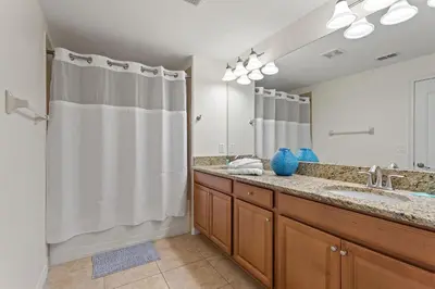 a bathroom with a shower and a sink at Refurbished! Lazy Life At Storey Lake By Shine Villas #901 in Kissimmee