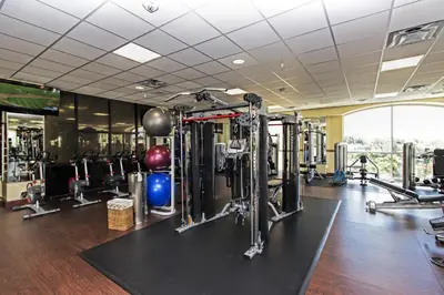 a gym with lots of equipment in a building at Westgate Lakes Resort and Spa in Orlando