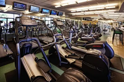 a gym filled with lots of cardio machines at Westgate Lakes Resort and Spa in Orlando