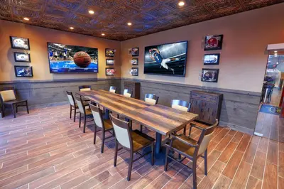 a dining room with a wooden table and chairs at Westgate Lakes Resort and Spa in Orlando