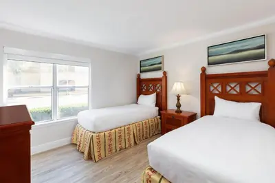 a hotel room with two beds and a window at Westgate Blue Tree Resort in Orlando