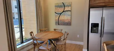 a kitchen with a table and chairs and a window at Magic Village 4 Bedroom! Welcome Home! in Orlando