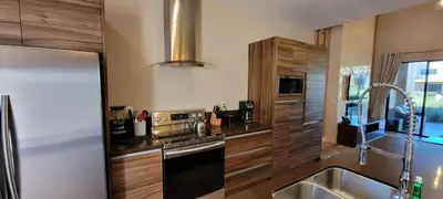 a kitchen with a sink and a stove and a refrigerator at Magic Village 4 Bedroom! Welcome Home! in Orlando
