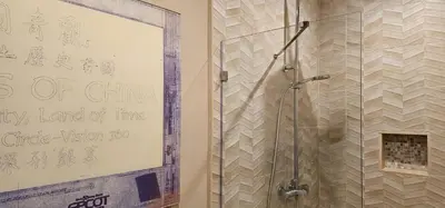 a bathroom with a shower with a sign on the wall at Magic Village 4 Bedroom! Welcome Home! in Orlando