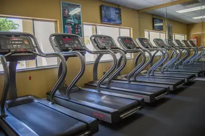 a row of empty bikes in a gym at Silver Lake Resort in Orlando