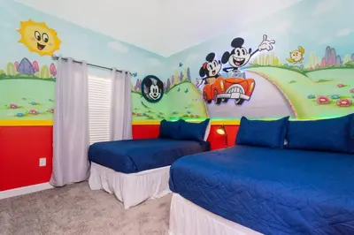 a room with two beds and a disney mural at Wonderful 5 Bd Close to Disney @ Storey Lake Resort 2980 in Kissimmee