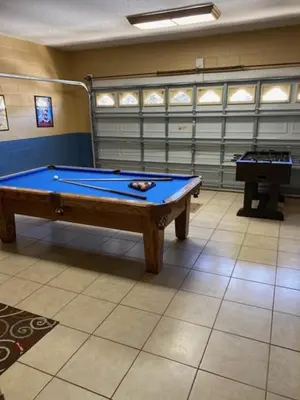 a billiard room with a pool table and a piano at Resort 5 Bed Private Pool & Spa, Game Room Home villa in Kissimmee