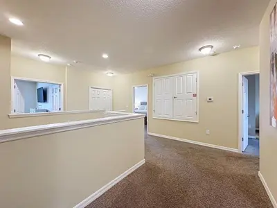 a large kitchen with a counter in a room at Veranda Home, 8br, 6 en-suites, Lake View,POOL SPA villa in Kissimmee