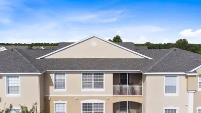 a house with a gray roof at Amazing Resort 2 bed condo close to Disney condo in Kissimmee