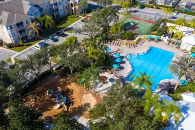 an aerial view of a pool at a resort at 4 Bedroom 3 Bath South Facing Pool Spa Villa villa in Kissimmee