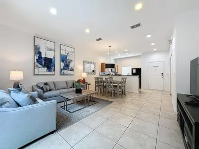 a living room with a couch and a table at Amazing Townhouse close to Disney 2 Bed 2,5 Bath townhouse in Kissimmee
