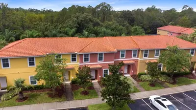 an aerial view of a house with an orange roof at Amazing Townhouse close to Disney 2 Bed 2,5 Bath townhouse in Kissimmee