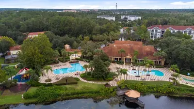 an aerial view of a home with a swimming pool at Amazing Townhouse close to Disney 2 Bed 2,5 Bath townhouse in Kissimmee