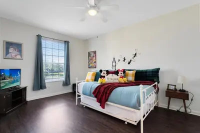 a bedroom with a bed with stuffed animals on it at Windsor Palms 3 bed Condo in Gated Resort condo in Kissimmee