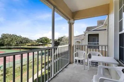 a balcony with a view of a tennis court at Windsor Palms 3 bed Condo in Gated Resort condo in Kissimmee