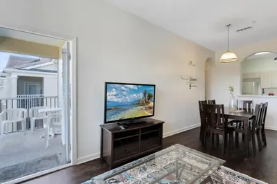a living room with a flat screen tv on a table at Windsor Palms 3 bed Condo in Gated Resort condo in Kissimmee