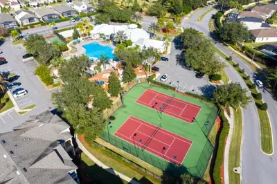 an overhead view of a tennis court with two tennis rackets at Windsor Palms 3 bed Condo in Gated Resort condo in Kissimmee