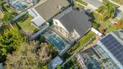 an overhead view of a house with a greenhouse at Elegant Villa Pool Fun Game Room Near Disney in Kissimmee