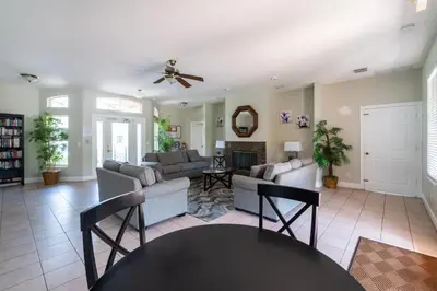 a living room with a couch and a table at 1192SBC South Beach Villa in Kissimmee