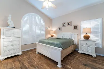 a bedroom with a bed and a dresser and a window at 16813GB Fun in the Sun in Orlando