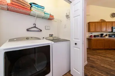 a kitchen with a washer and dryer in a room at 16813GB Fun in the Sun in Orlando