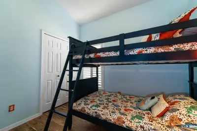 a bedroom with two bunk beds and a bed at 16813GB Fun in the Sun in Orlando