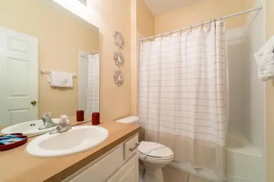 a bathroom with a sink and a toilet and a shower at WH2618DS Windsor Hills Retreat in Orlando