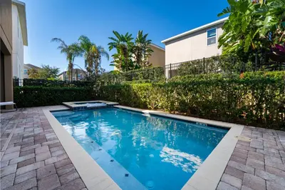 a swimming pool in the backyard of a house at 360LD Encore Magic Villa in Orlando
