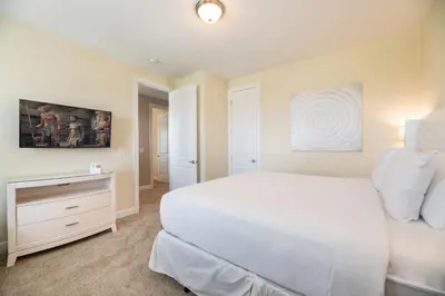 a white bedroom with a large bed and a dresser at Gorgeous Home With Media, Disney Themed Kids Room Near Disney With Waterpark & Resort Access At Encore Resort - 771La in Kissimmee