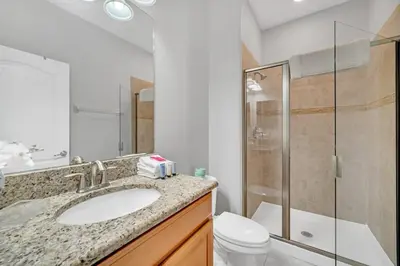 a bathroom with a sink and a shower and a toilet at In the heart of Kissimmee Storey Lake Resort 4BD 3BA Pool Townhome 4SL4857 in Kissimmee