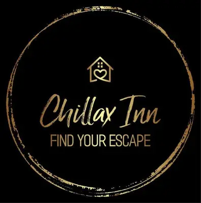 a gold logo with the words chilka inn to find your escape at Luxury 5BR Villa Near Disney, Private Pool & Game Room in Orlando