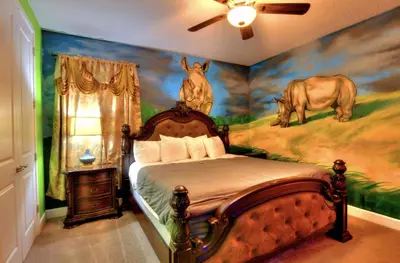 a bedroom with a mural of a horse on the wall at NEW! 14BR Disney-Area Resort with Bowling & Theater in Kissimmee