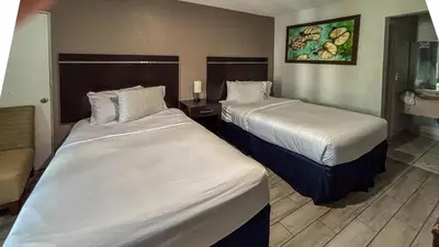 a hotel room with two beds in a room at Motel 6 Altamonte Springs FL in Orlando