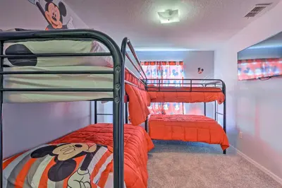 a bunk bed room with two bunk beds at Less Than 8 Mi to Disney Getaway with Deck in Kissimmee! in Kissimmee