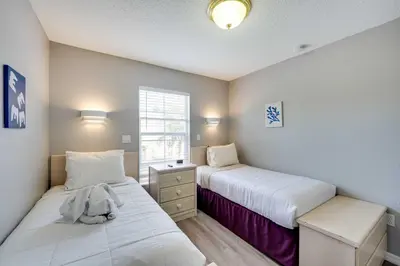 a bedroom with two beds and a window at Kissimmee Escape about 10 Mi to Disney World! in Kissimmee