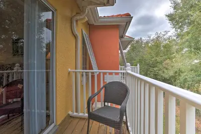 a chair sitting on the porch of a house at Kissimmee Escape about 10 Mi to Disney World! in Kissimmee