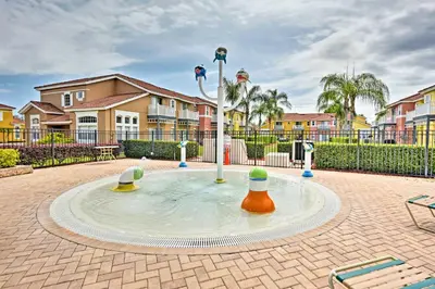 a playground in the middle of a courtyard at Kissimmee Escape about 10 Mi to Disney World! in Kissimmee