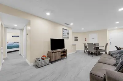 a living room with a couch and a flat screen tv at Orlando Vacational Apartment 3919 in Orlando