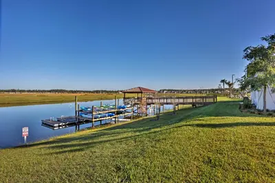 a marina with boats on the water at 6 Mi to Disney Resort Hideaway with Pool Access! in Kissimmee