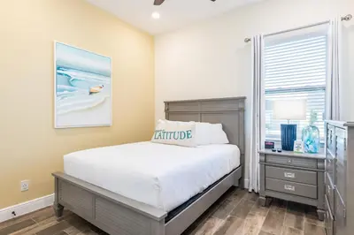 a bedroom with a bed and a desk and a window at Mango Breeze Cottage With Private Pool Near Disney With Margaritaville Resort And Island H20 Waterpark Access - 2910Sr in Orlando