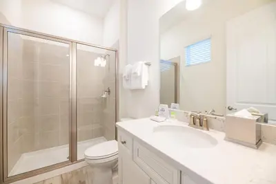 a bathroom with a shower and a sink and a toilet at Blue Sky Cottage Near Disney With Private Pool & Margaritaville Resort And Island H20 Waterpark Access - 2912Sr in Orlando