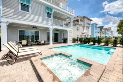 a swimming pool in front of a house at Brilliant Cottage Near Disney With Private Pool & Margaritaville Resort & Island H20 Waterpark Access - 3080Ph in Orlando