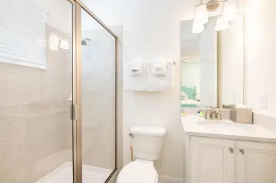 a bathroom with a shower and a toilet and a sink at Brilliant Cottage Near Disney With Private Pool & Margaritaville Resort & Island H20 Waterpark Access - 3080Ph in Orlando