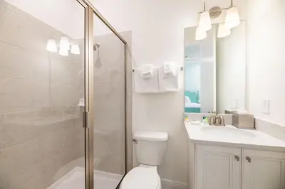 a bathroom with a shower and a toilet and a sink at Brilliant Cottage Near Disney With Private Pool & Margaritaville Resort & Island H20 Waterpark Access - 3080Ph in Orlando