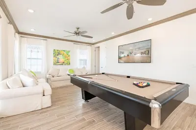 a living room with a pool table and a couch at Brilliant Cottage Near Disney With Private Pool & Margaritaville Resort & Island H20 Waterpark Access - 3080Ph in Orlando