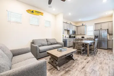 a living room with a couch and a table at Anchor Cottage With Private Pool Near Disney And Margaritaville Resort & Island H2O Access - 8020Kd in Orlando