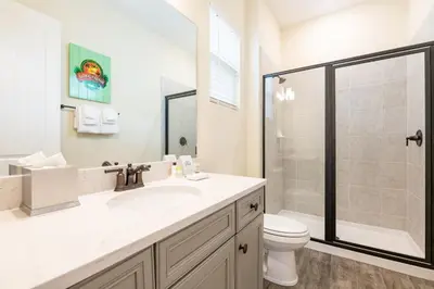 a bathroom with a sink and a toilet and a shower at Anchor Cottage With Private Pool Near Disney And Margaritaville Resort & Island H2O Access - 8020Kd in Orlando