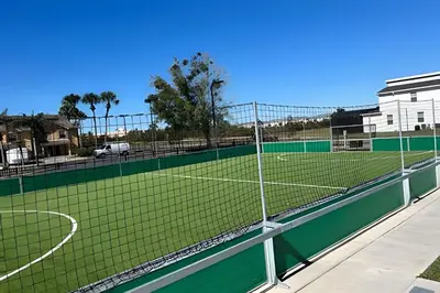 a tennis court with a net on top of it at Storey Lake home close to Disney and other parks in Kissimmee