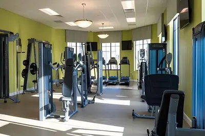 a gym with treadmills and cardio machines at Storey Lake home close to Disney and other parks in Kissimmee