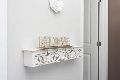 a white door with a shelf on the wall at Gorgeous and New House at Le Reve Resort (214221) in Kissimmee